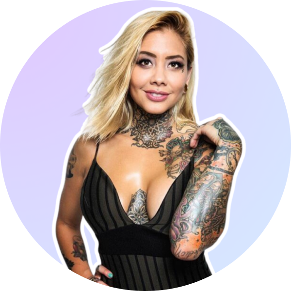 Woman with blonde hair and tattoos, wearing a black striped dress, posing with one hand on her shoulder against a light purple background, perfect for a social media planner | plannthat.com